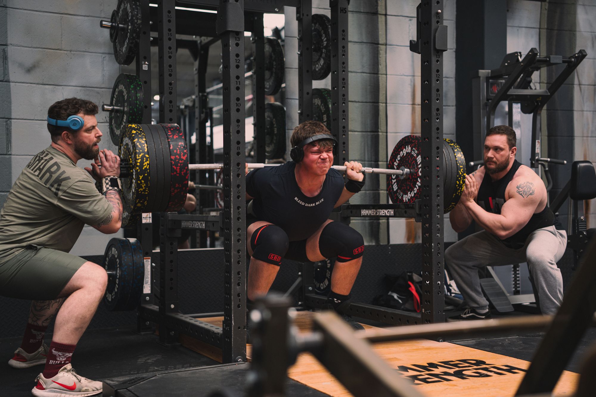 Squat with spotters